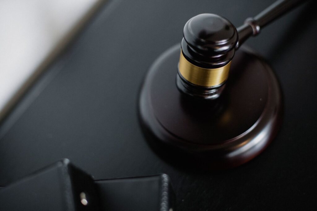 Judge's gavel on a courtroom desk